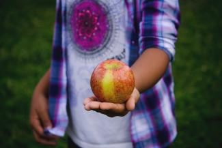 Child with apple.